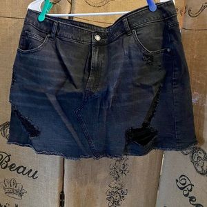 Ripped black denim skirt